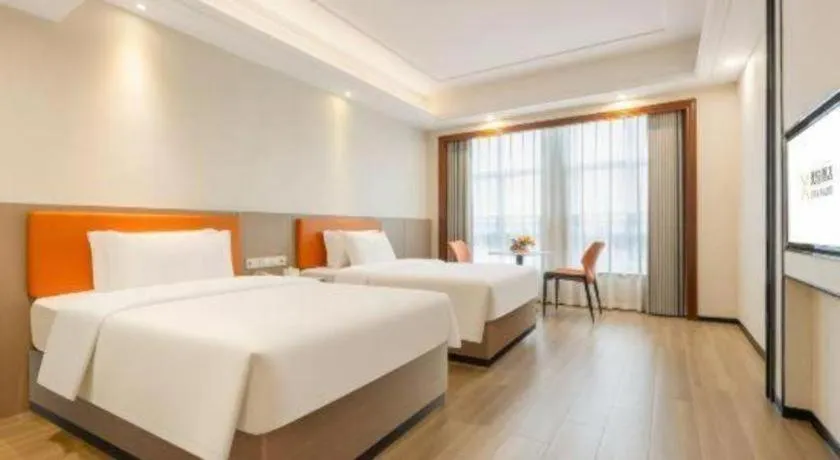 Bed in Vienna International Hotel Nanning Railway Station Mingxiu Road Metro Station