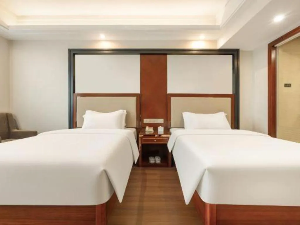 Bed in Vienna International Hotel Nanning Railway Station Mingxiu Road Metro Station