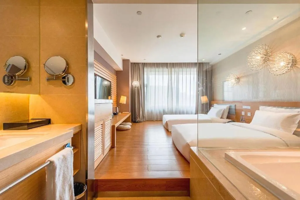 Bed in Guangzhou Crystal Orange Hotel