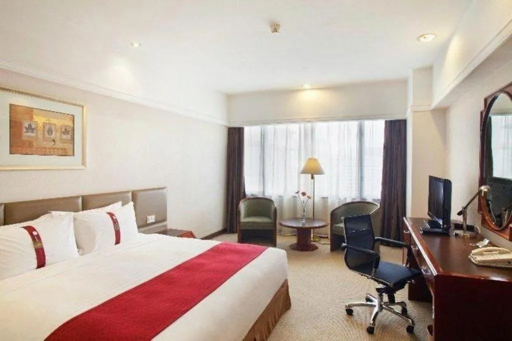 Bed in Guangzhou Crystal Orange Hotel