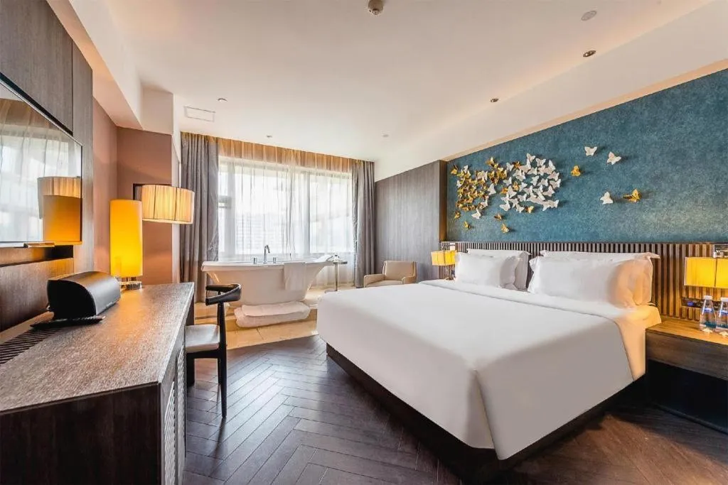 Bed in Guangzhou Crystal Orange Hotel