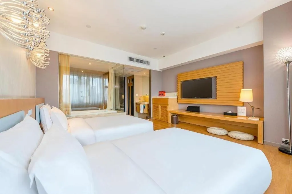 Bed in Guangzhou Crystal Orange Hotel