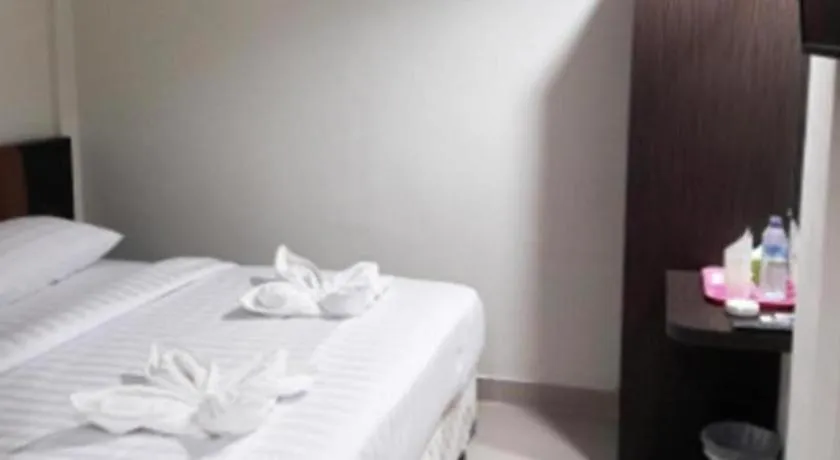 Bed in Karimun City Hotel