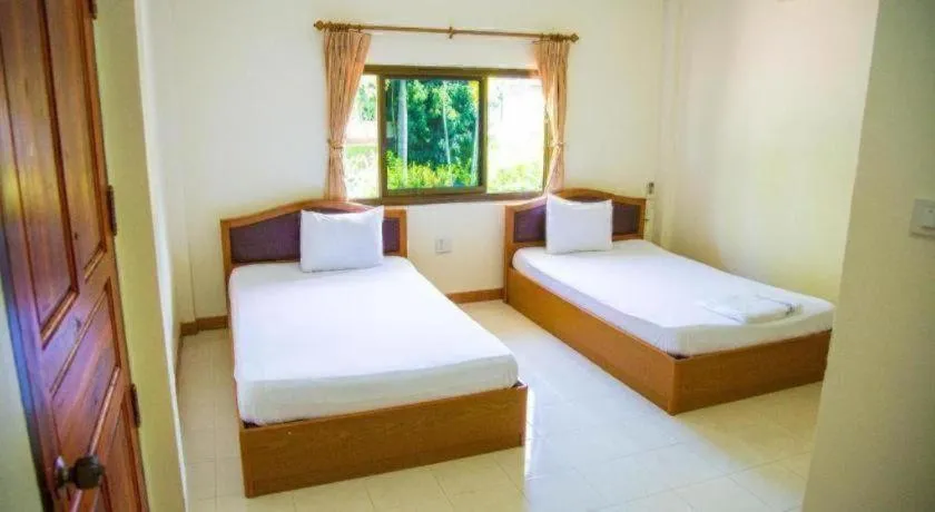Bed in TAWANCHAY HOTEL PHATTHALUNG