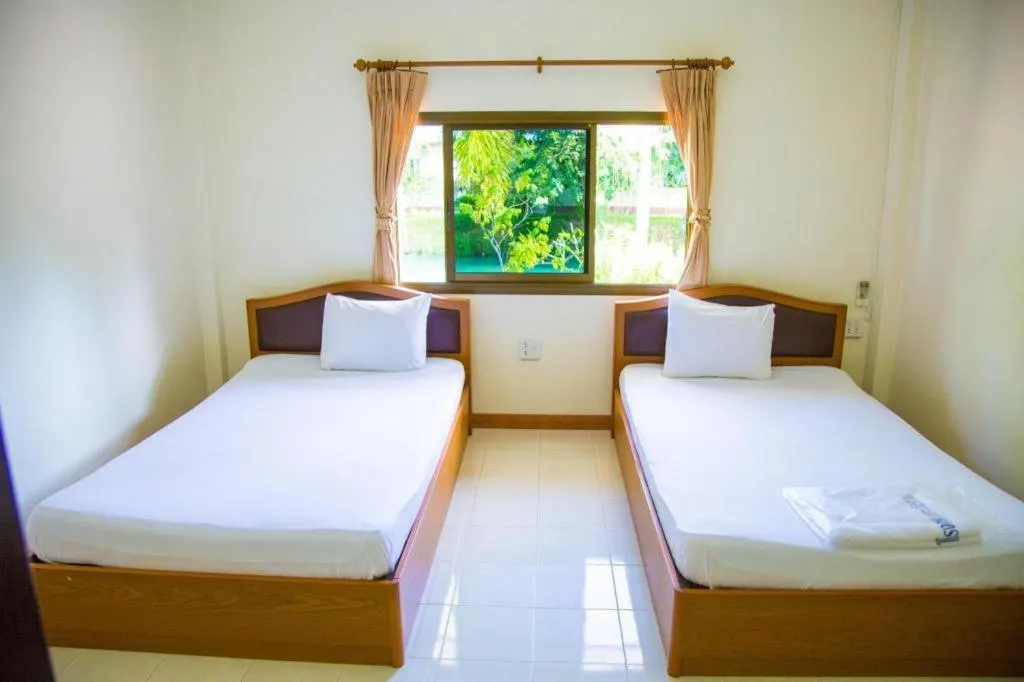 Bed in TAWANCHAY HOTEL PHATTHALUNG
