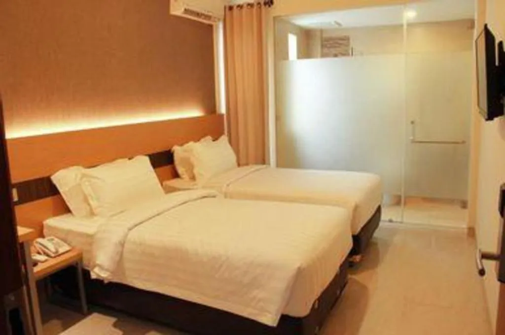 Bed in Sumi Hotel Surabaya