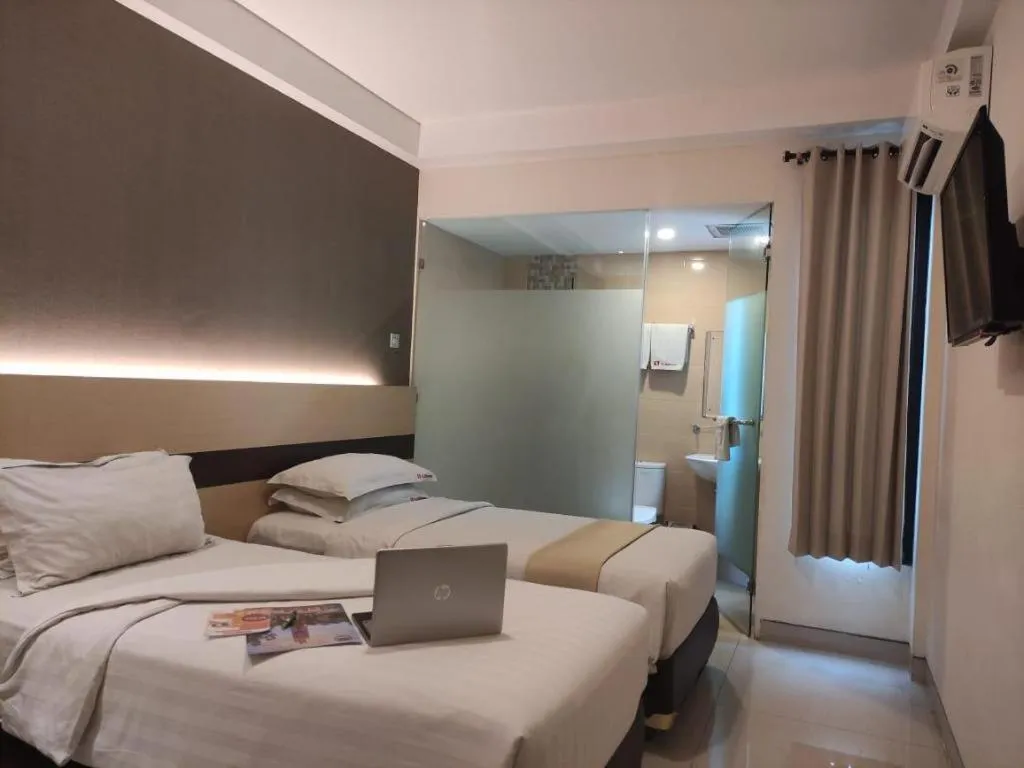 Bed in Sumi Hotel Surabaya