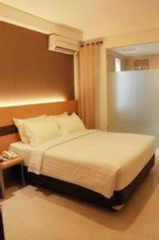 Bed in Sumi Hotel Surabaya