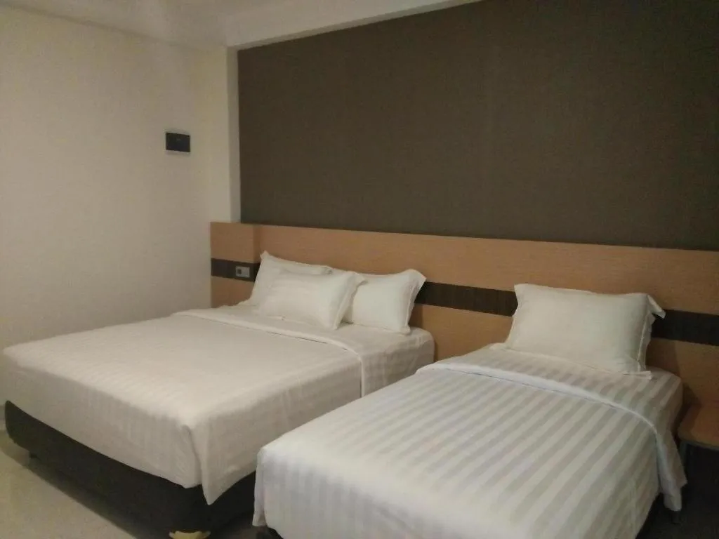 Bed in Sumi Hotel Surabaya