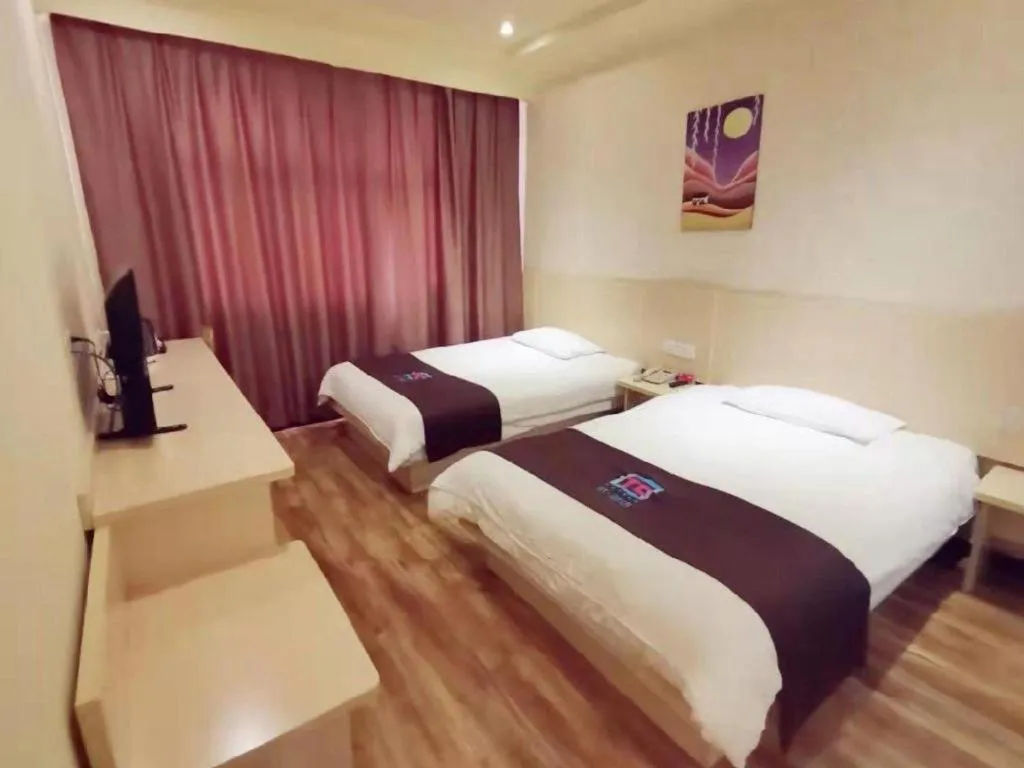 Bed in Pai Hotel Tianjin Binguan Metro Station Municipal Government