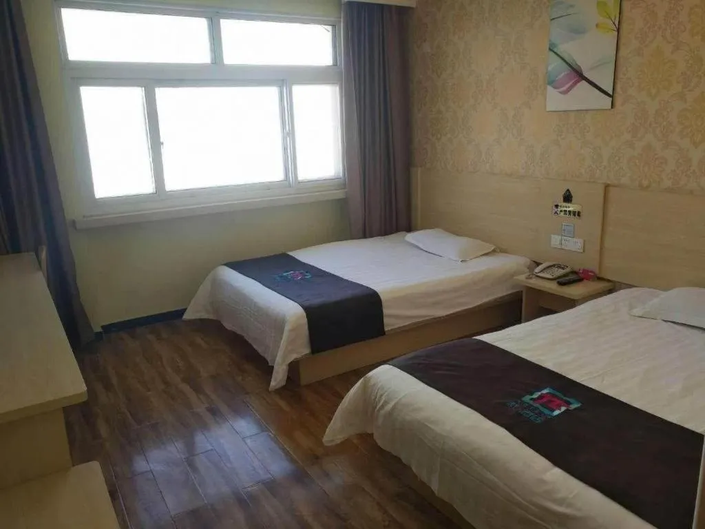 Bed in Pai Hotel Tianjin Binguan Metro Station Municipal Government