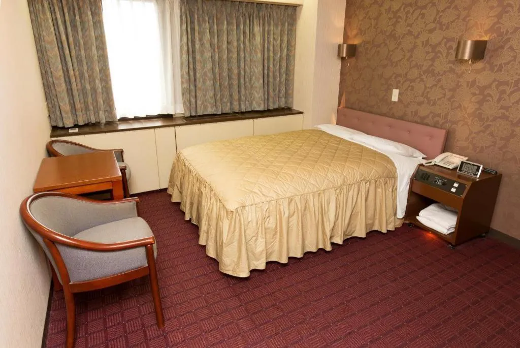 Bed in Hotel Suncity Ikebukuro