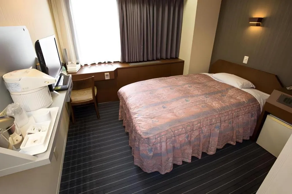 Bed in Hotel Suncity Ikebukuro