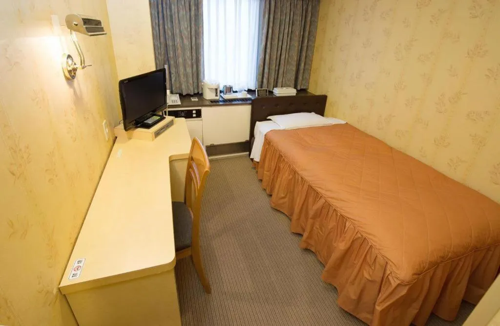 Bed in Hotel Suncity Ikebukuro