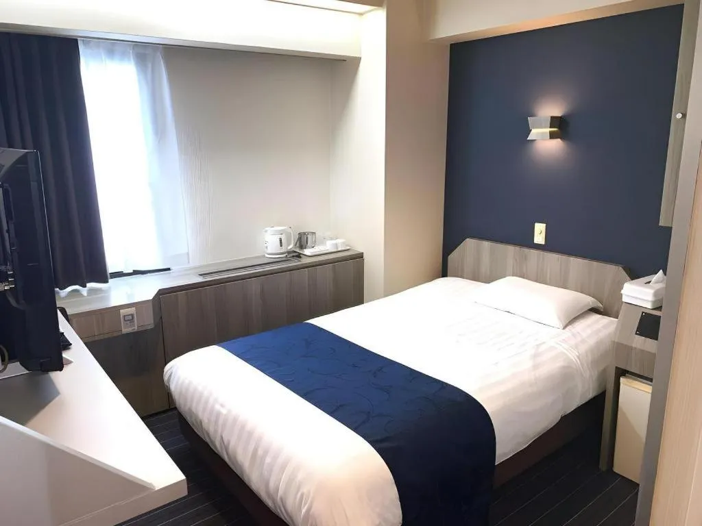 Bed in Hotel Suncity Ikebukuro