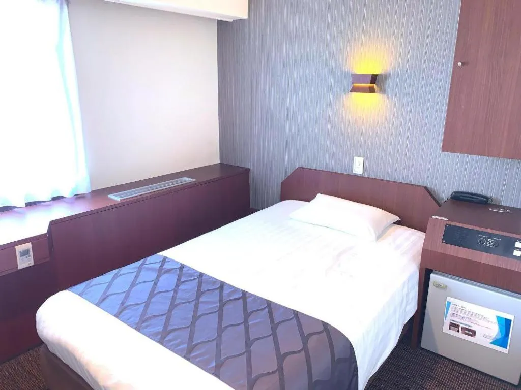 Bed in Hotel Suncity Ikebukuro