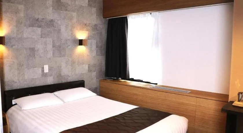 Bed in Hotel Suncity Ikebukuro