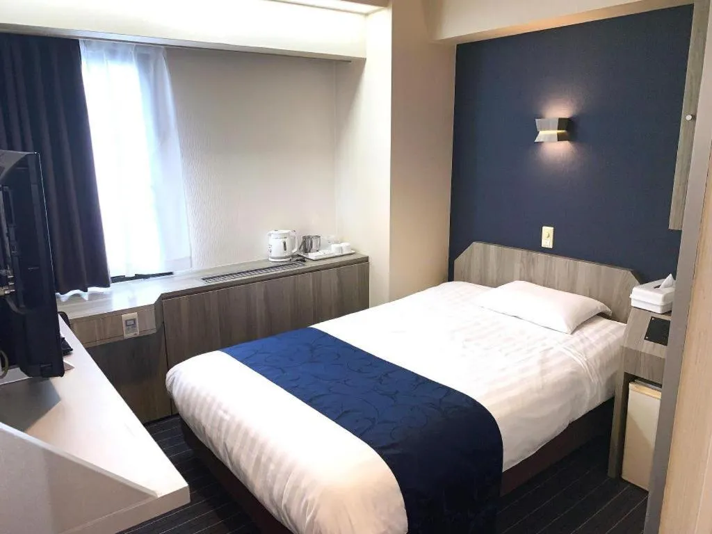 Bed in Hotel Suncity Ikebukuro