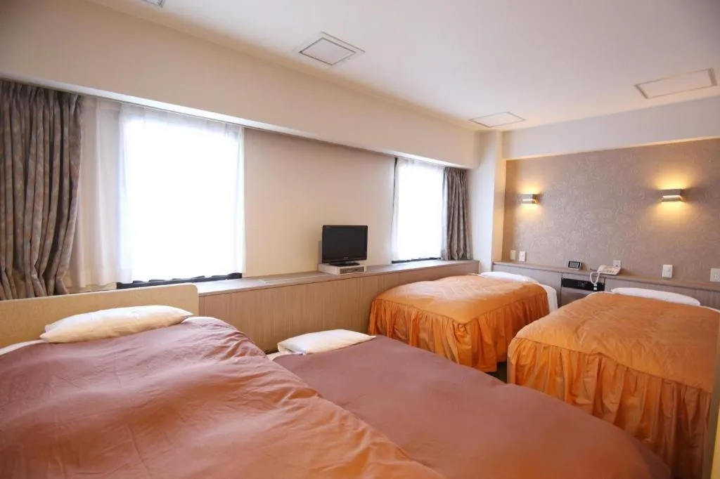 Bed in Hotel Suncity Ikebukuro