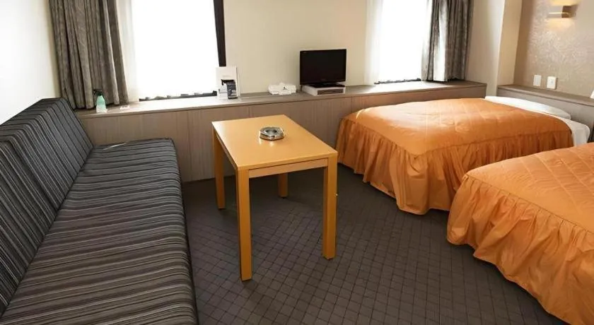 Bed in Hotel Suncity Ikebukuro