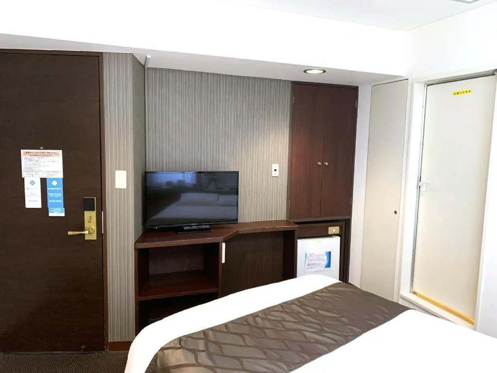 Bed in Hotel Suncity Ikebukuro