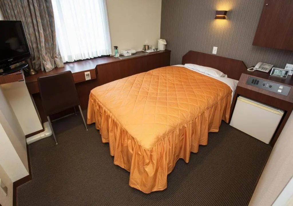 Bed in Hotel Suncity Ikebukuro