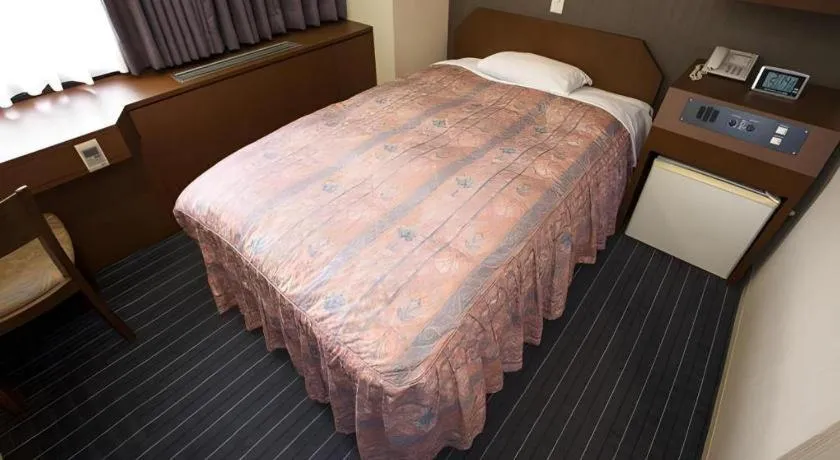 Bed in Hotel Suncity Ikebukuro