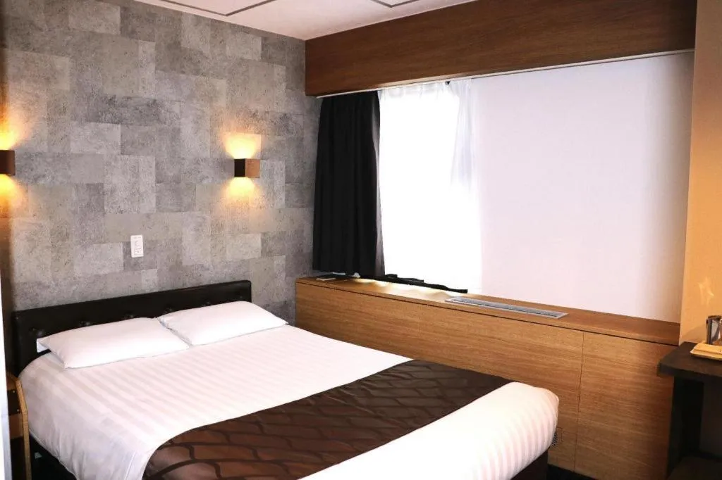 Bed in Hotel Suncity Ikebukuro