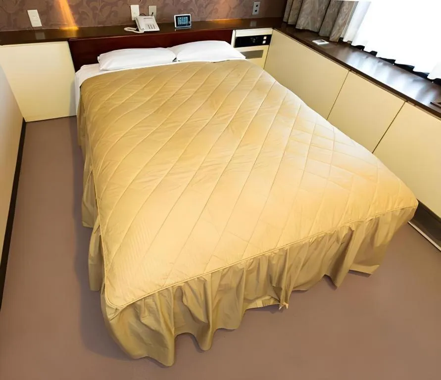 Bed in Hotel Suncity Ikebukuro