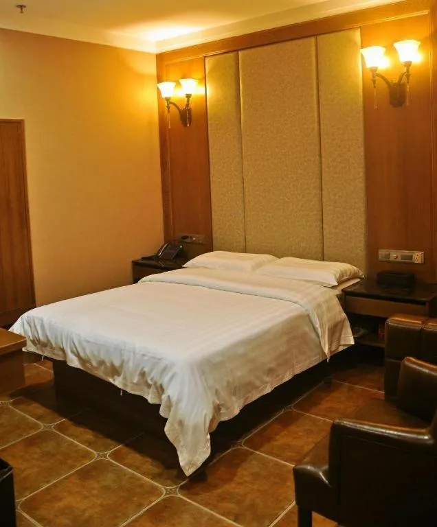 Bed in LINCOLN CARNIVAL HOTEL