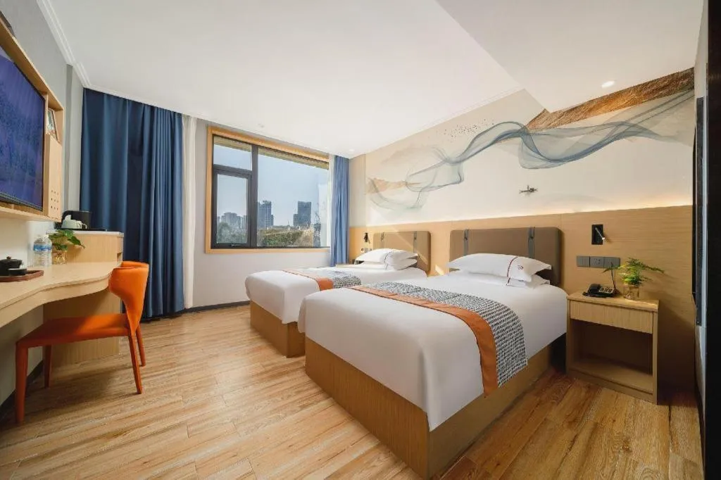 Bed in JIAN AI XI YUE HOTEL