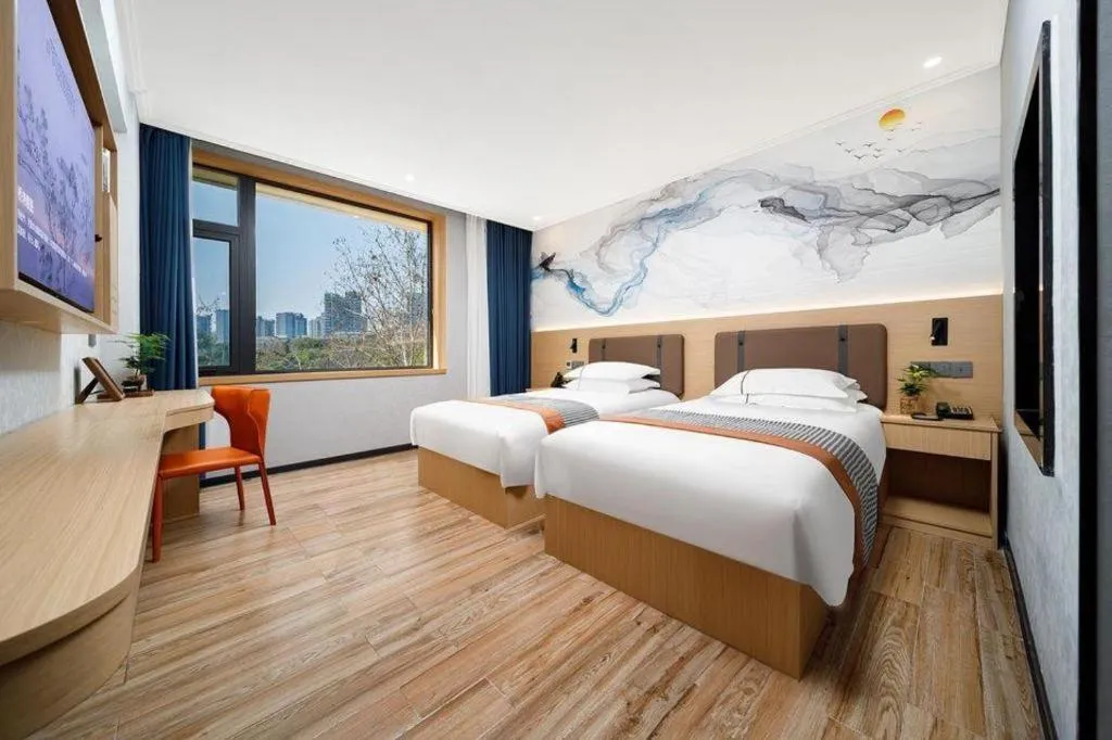 Bed in JIAN AI XI YUE HOTEL