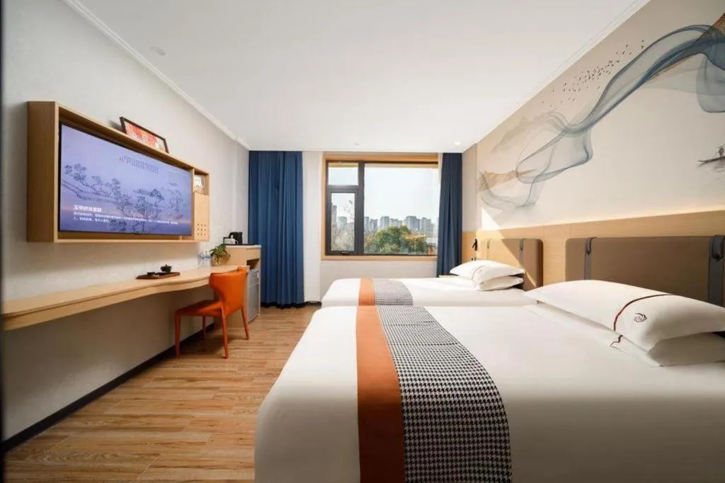 Bed in JIAN AI XI YUE HOTEL