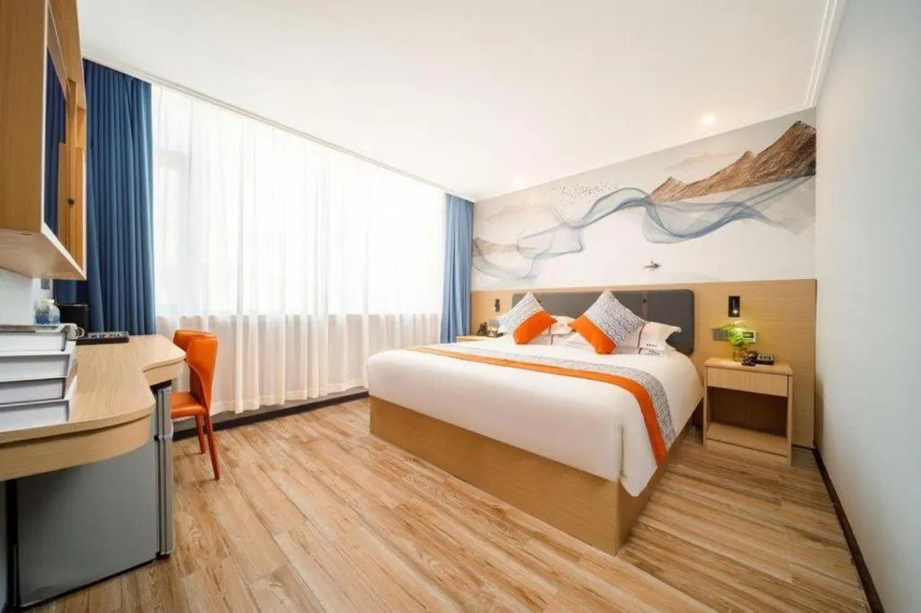 Bed in JIAN AI XI YUE HOTEL