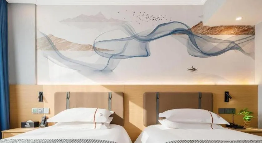 Bed in JIAN AI XI YUE HOTEL