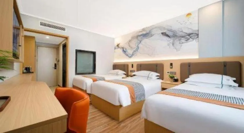 Bed in JIAN AI XI YUE HOTEL