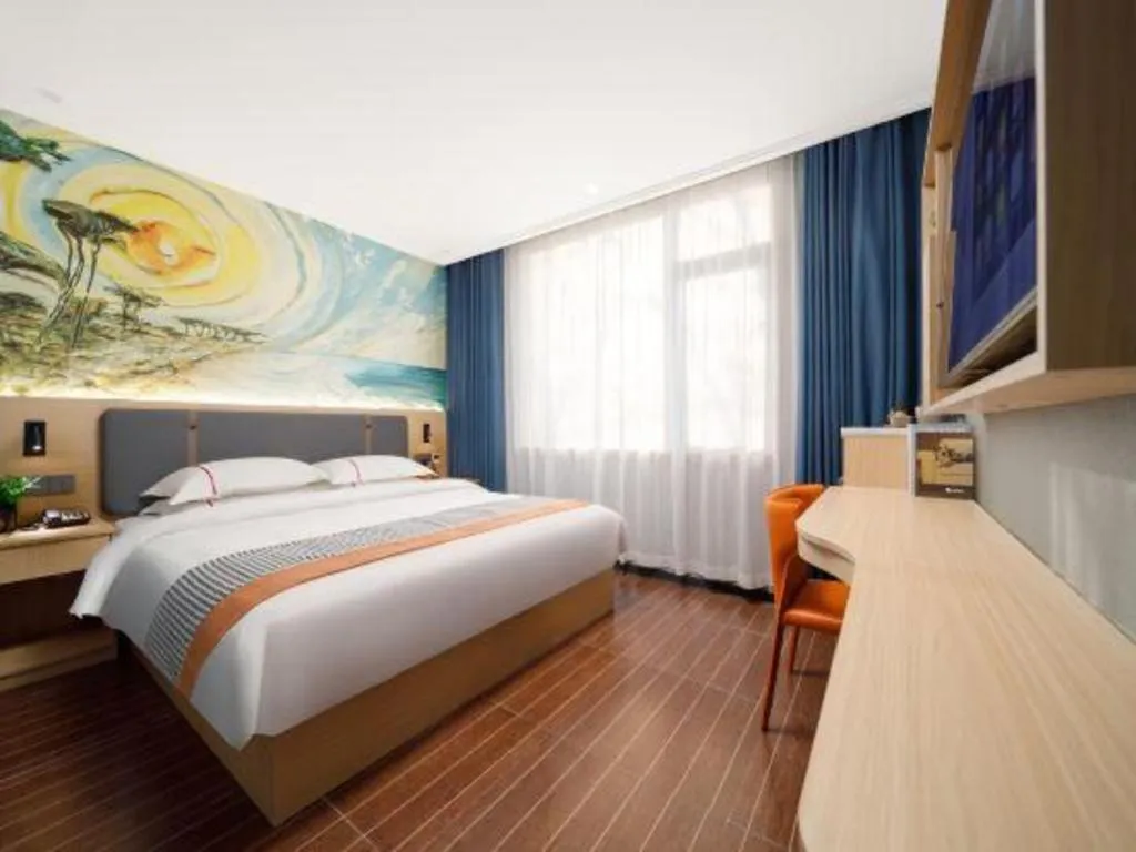 Bed in JIAN AI XI YUE HOTEL