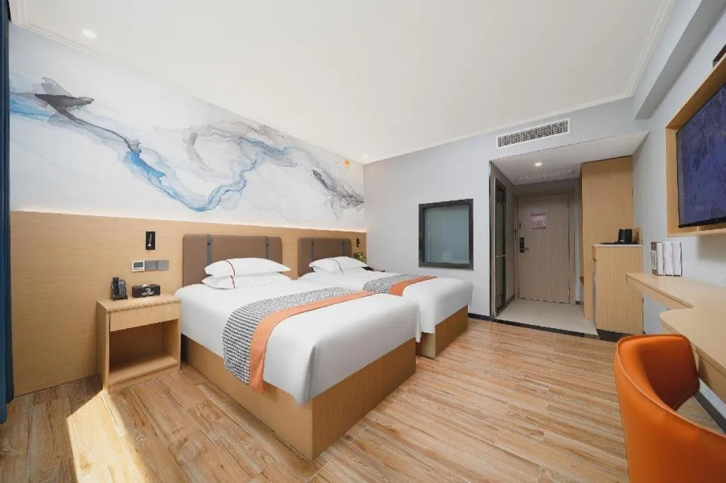 Bed in JIAN AI XI YUE HOTEL