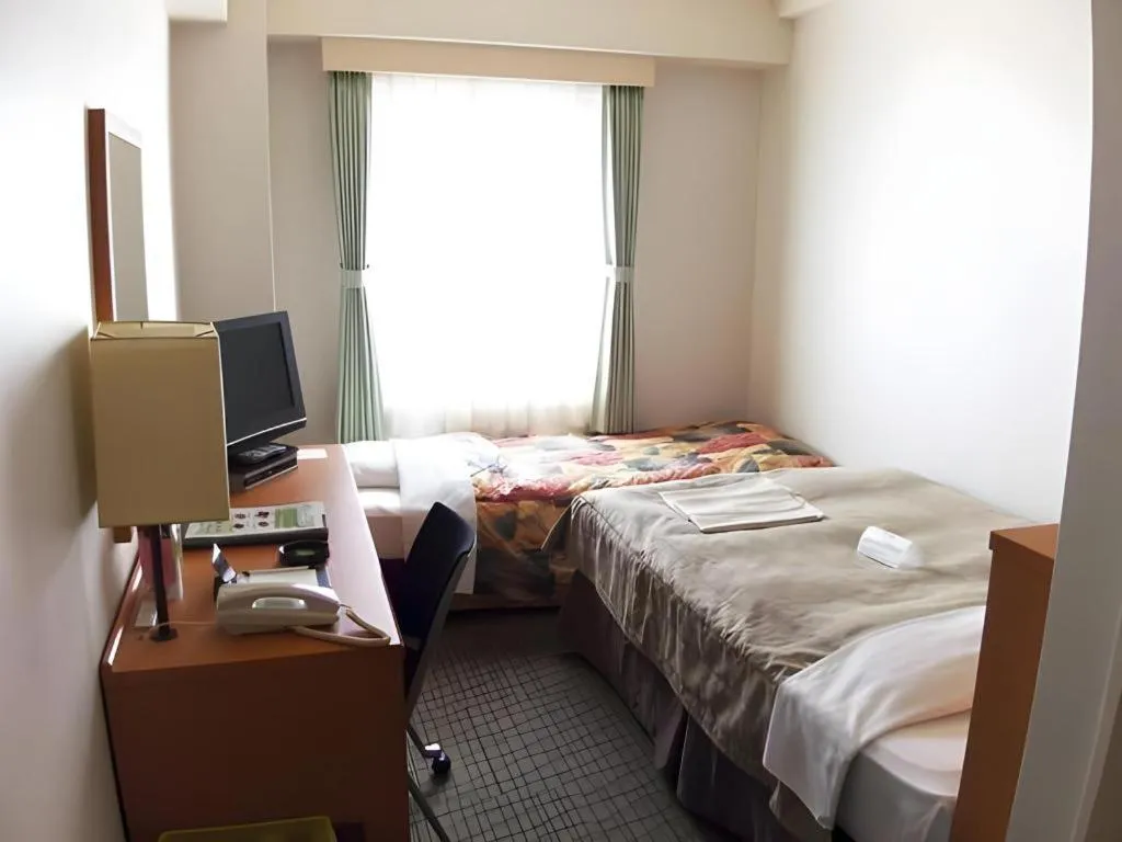 Bed in Sapporo Hotel Yamachi