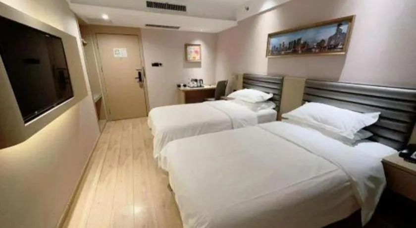 Bed in Metropolo Hotel Qingdao Wusi Square Xiaomaidao