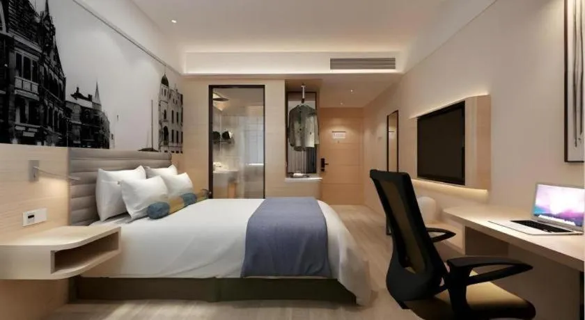 Bed in Metropolo Hotel Qingdao Wusi Square Xiaomaidao