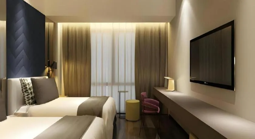 Bed in Metropolo Hotel Qingdao Wusi Square Xiaomaidao