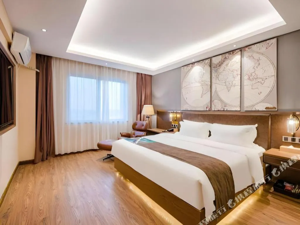 Bed in James Joyce Coffetel Xinyang Xixian Longhu Huayi