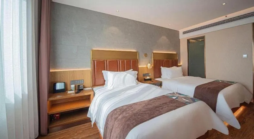 Bed in James Joyce Coffetel Xinyang Xixian Longhu Huayi