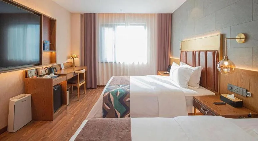 Bed in James Joyce Coffetel Xinyang Xixian Longhu Huayi