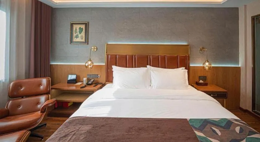 Bed in James Joyce Coffetel Xinyang Xixian Longhu Huayi