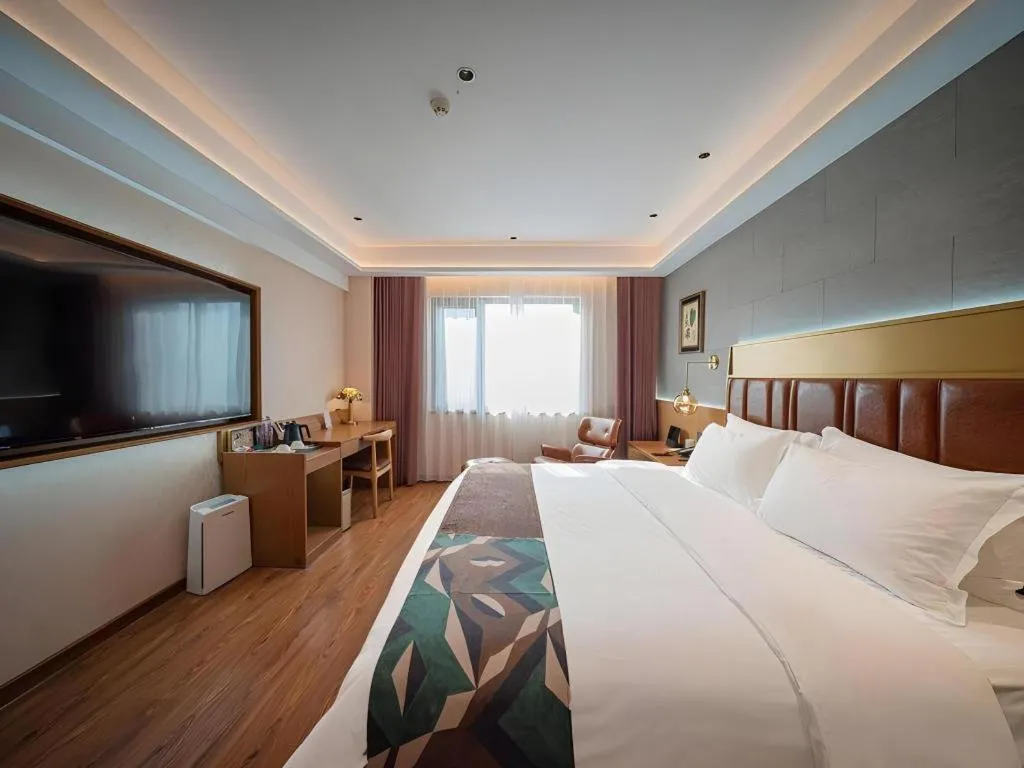 Bed in James Joyce Coffetel Xinyang Xixian Longhu Huayi