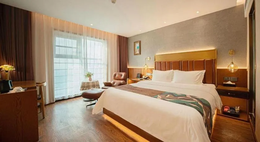 Bed in James Joyce Coffetel Xinyang Xixian Longhu Huayi