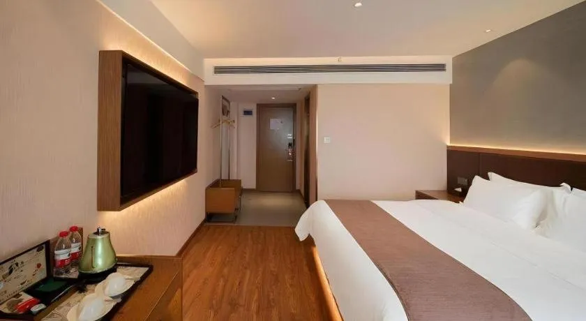 Bed in James Joyce Coffetel Xinyang Xixian Longhu Huayi