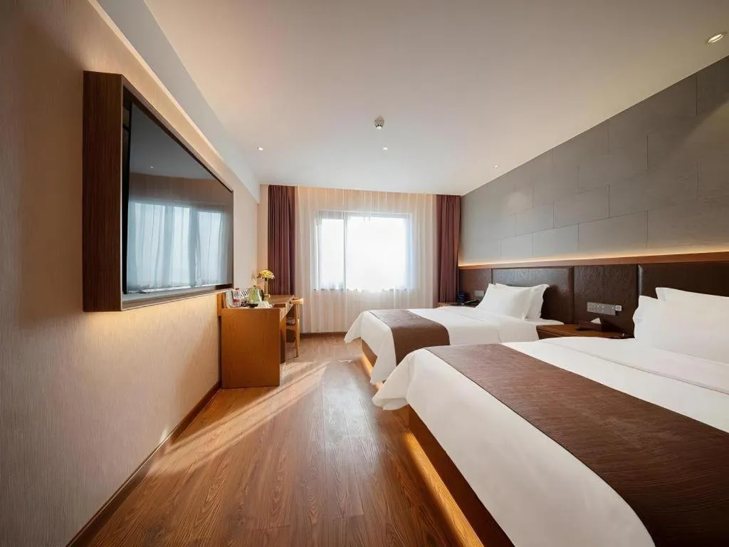 Bed in James Joyce Coffetel Xinyang Xixian Longhu Huayi